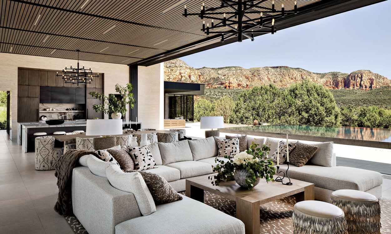 Open luxury living area with mountain views and pool edge